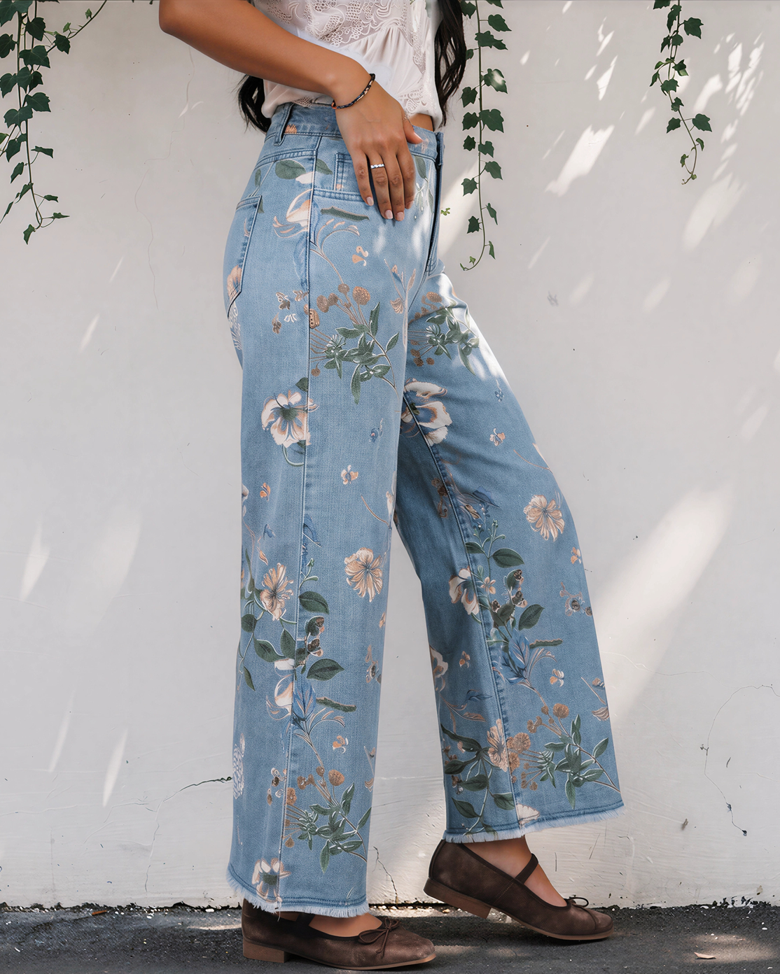 Light blue floral print wide-leg shift jeans with button front and frayed cuffs