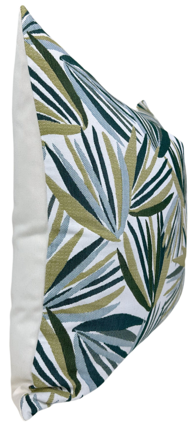 Square throw pillow cover with tropical leaf pattern and visible piping along the edge.