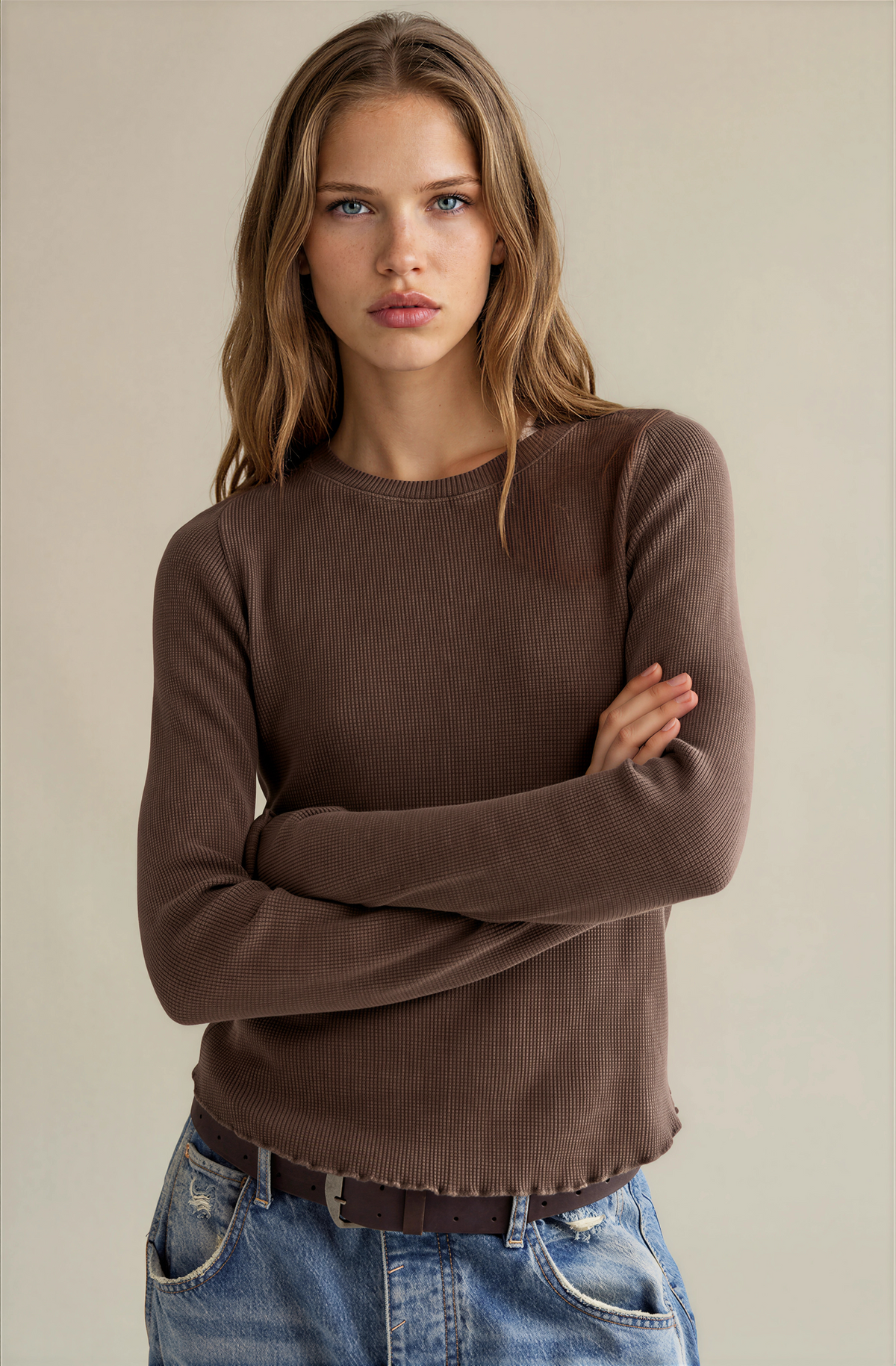 Brown long-sleeve crewneck tee with ribbed texture and fitted hem