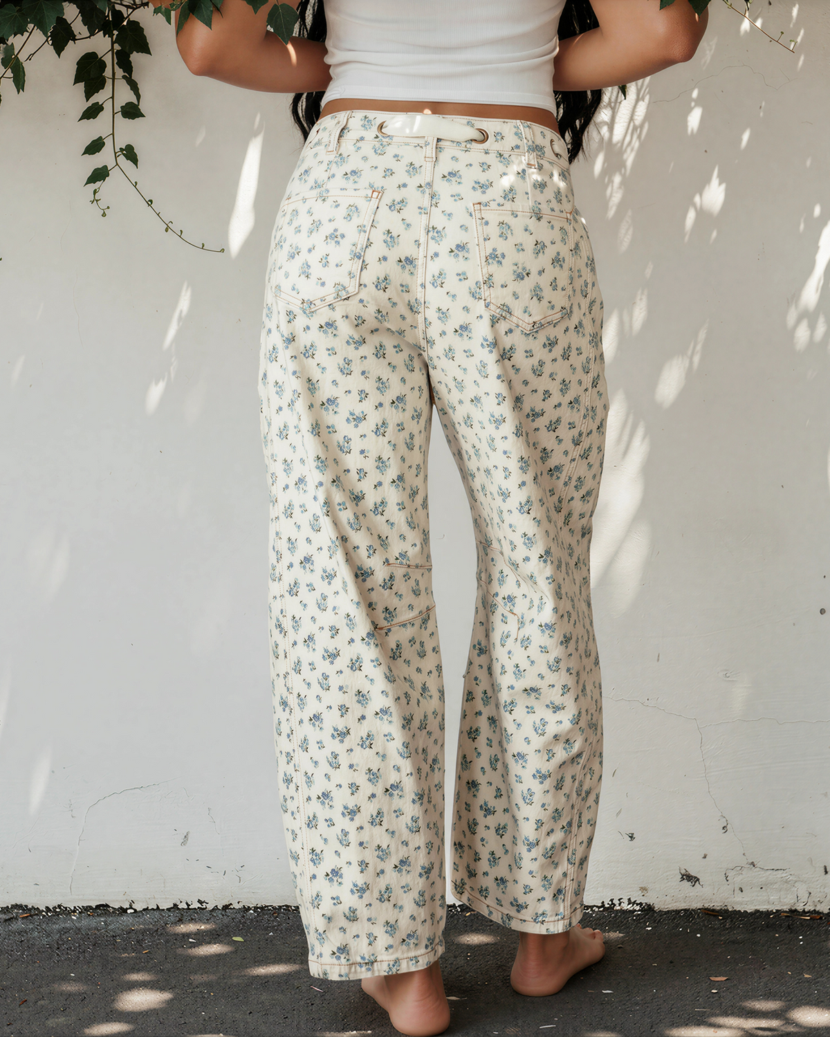 Floral barrel-leg jeans with grommet tie waistband, light fabric with blue-green micro flowers