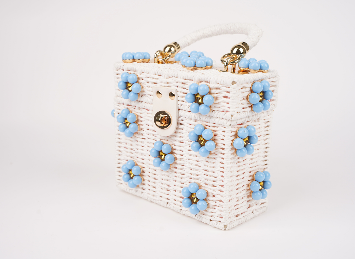 Sea Breeze woven straw handbag, side view, blue beaded medallions and gold-tone clasp