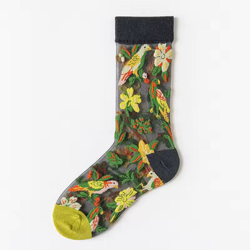 Sheer plant lover socks with bright floral garden embroidery on dark fabric