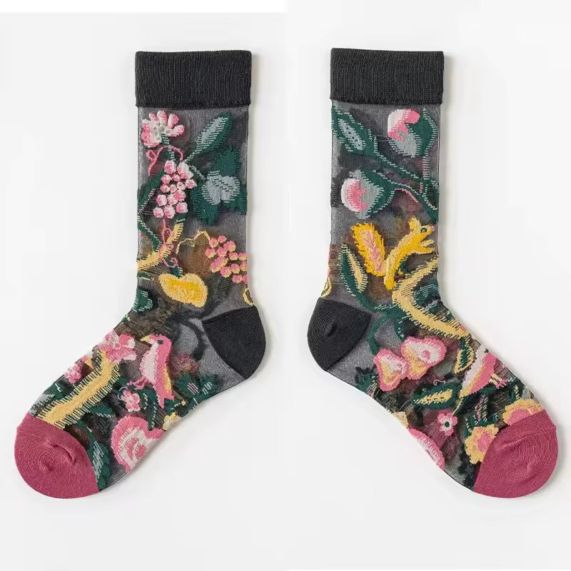 Pair of sheer crew socks with dark botanical pattern, pink flowers, green leaves, maroon toe