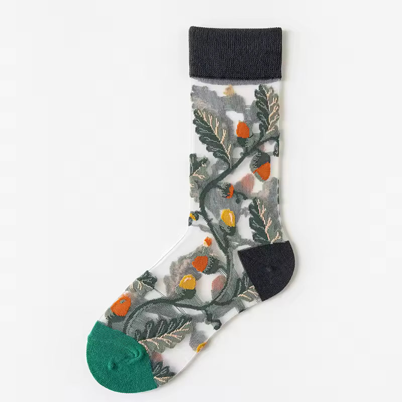 Sheer crew socks with grey leaf branches, orange berries, teal cuff, and green toe