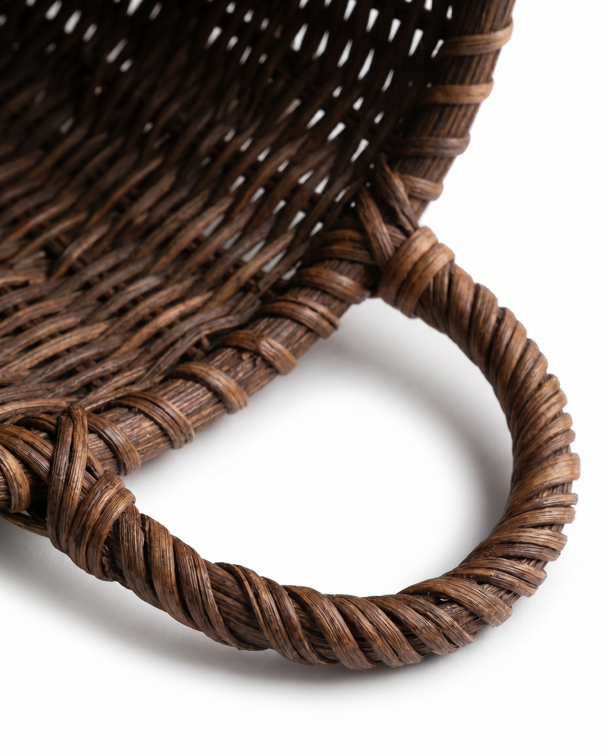 Woven rattan basket rim with braided edge detail and open top