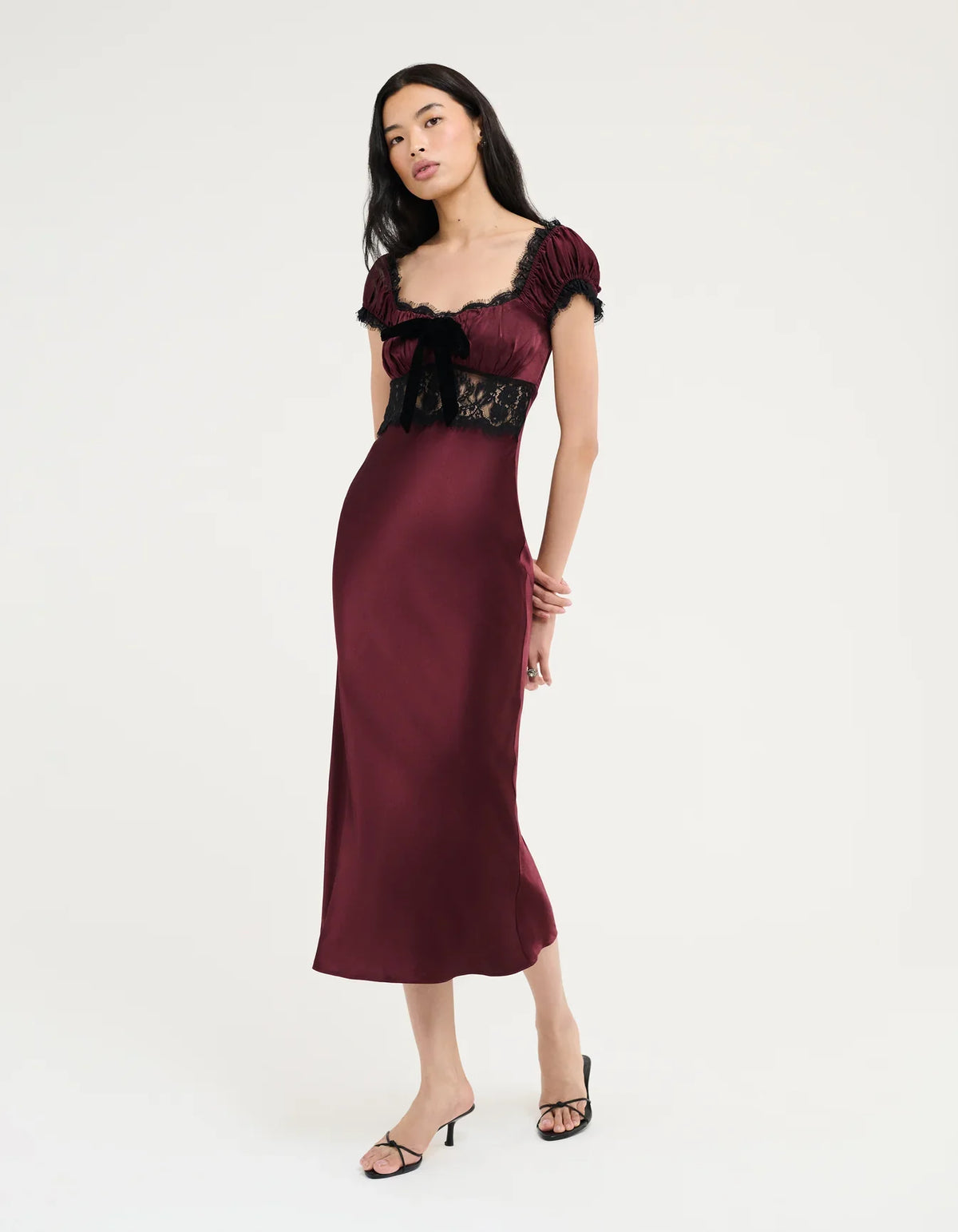 Burgundy midi dress with black lace neckline and puff sleeves with ruffled trim