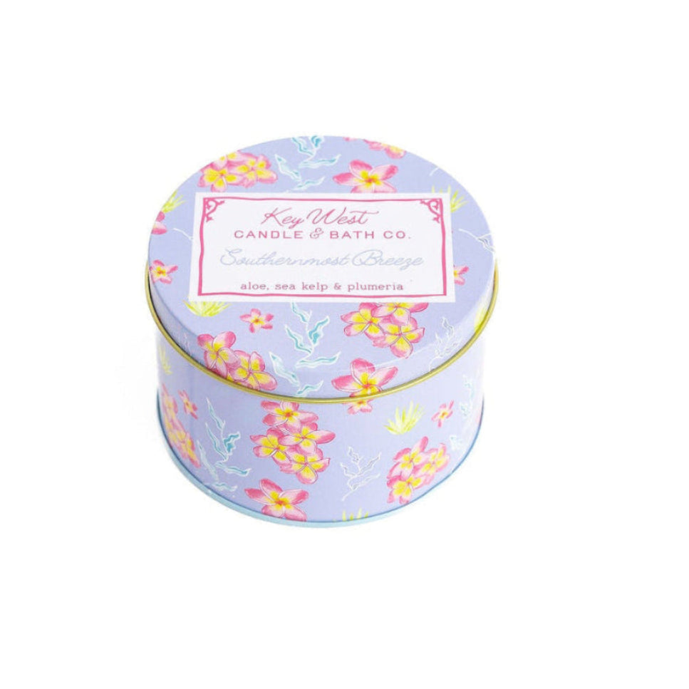 Round candle travel tin with pastel floral pattern and Key West label on lid