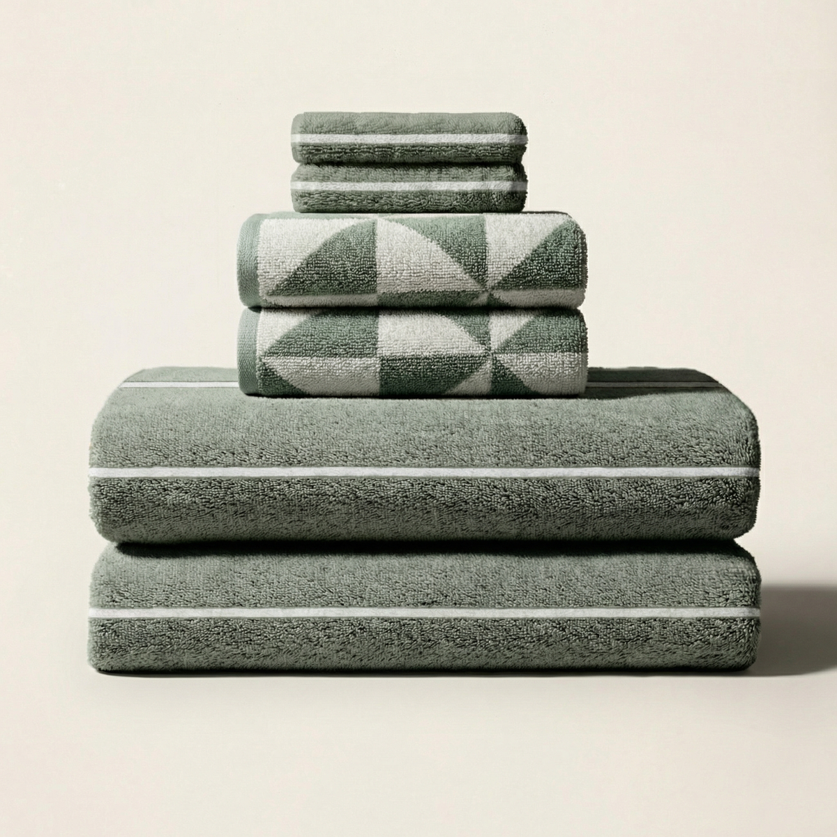 Stacked cotton towels, sage-and-ecru diamond plaid pattern
