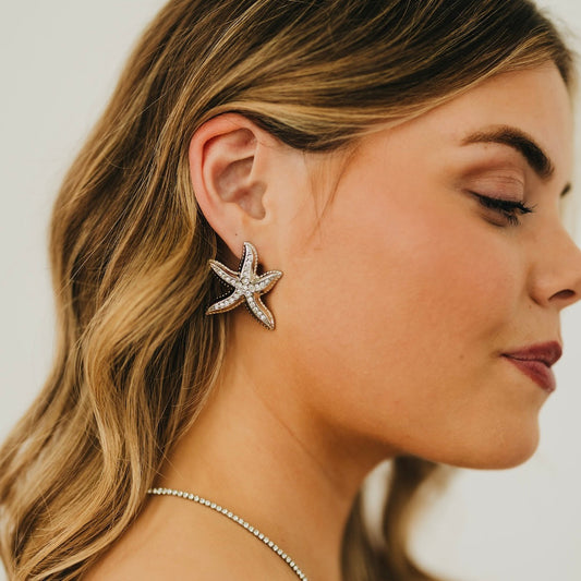 Starfish earrings, silver tone with crystal-studded starfish detail