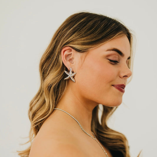 Starfish drop earrings, silver tone with small crystal accents