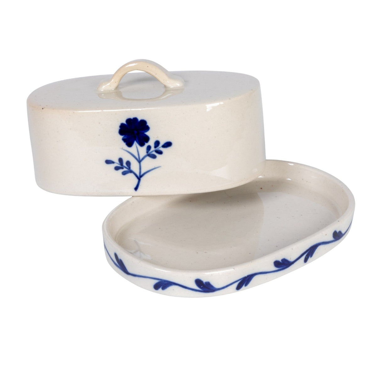 Butter dish with lid partly open, cream tray with blue floral vine border