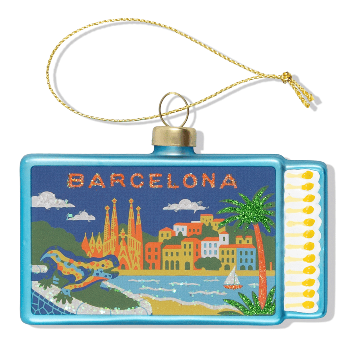 Matchbook ornament with gold loop, blue frame, and Barcelona city scene