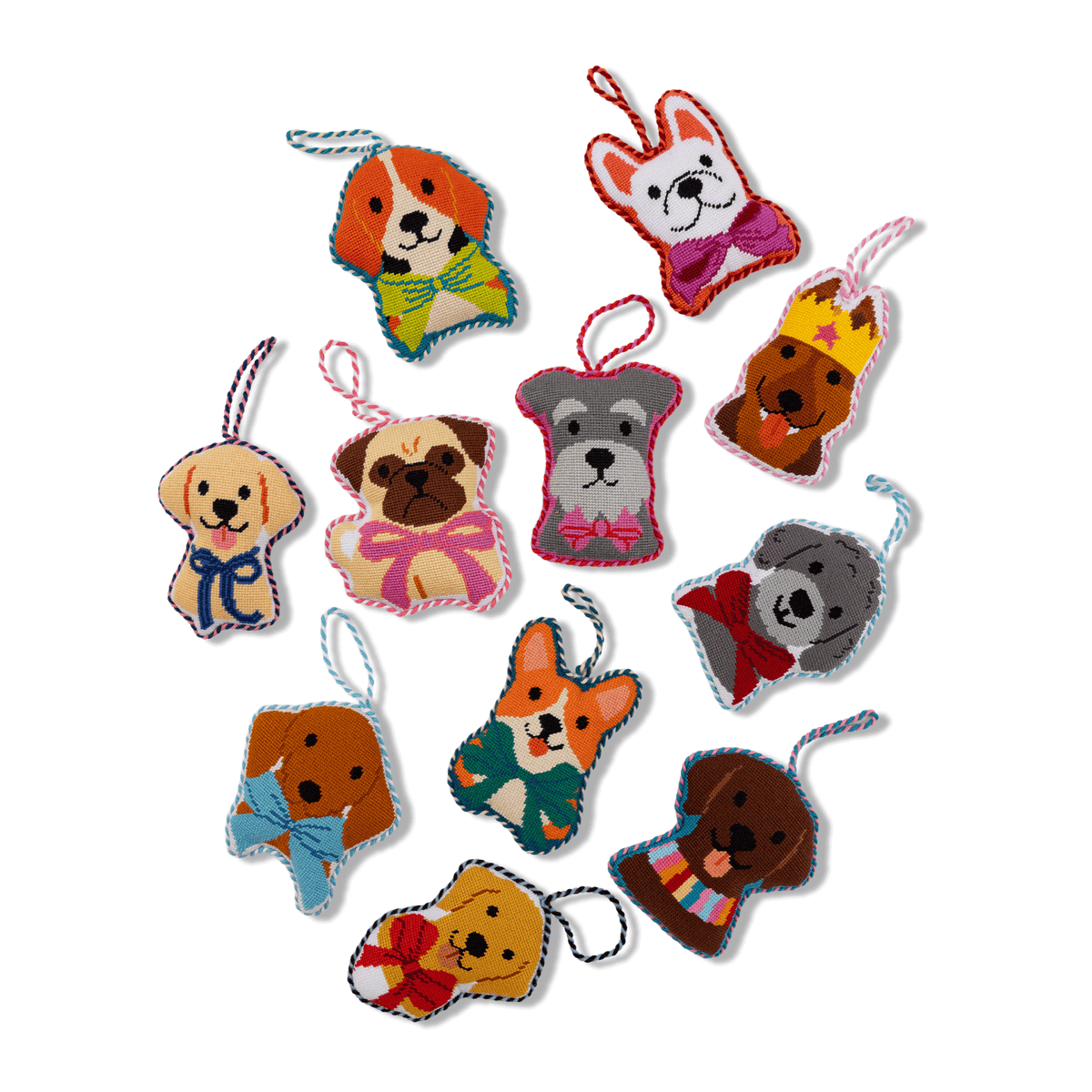 Needlepoint Schnauzer icon ornament, gray dog face among assorted dog-shaped needlepoint