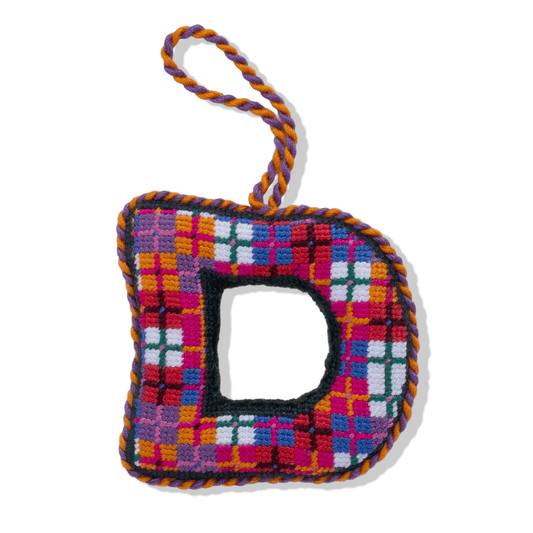 Needlepoint monogram ornament letter D with multicolor plaid grid stitches and hanging loop