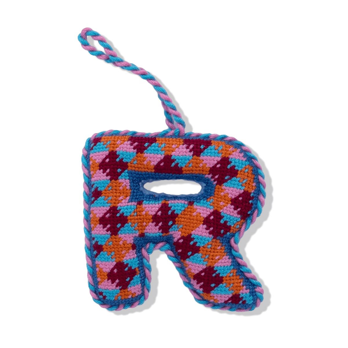 Needlepoint letter R ornament with multicolor stitched plaid pattern and hanging loop