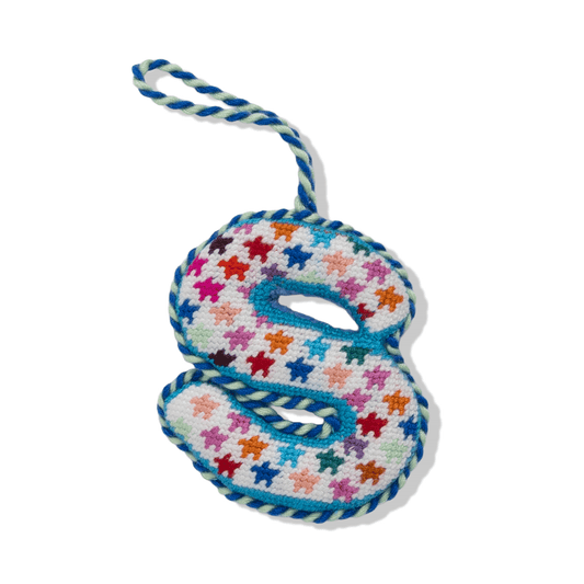 Needlepoint monogram ornament S with multicolor stitched pattern, hanging loop.