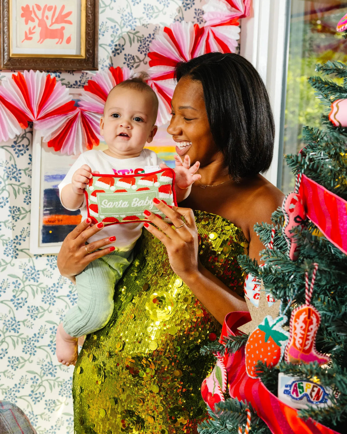 Mini needlepoint pillow showing Santa Baby lettering in red and green needlepoint pattern