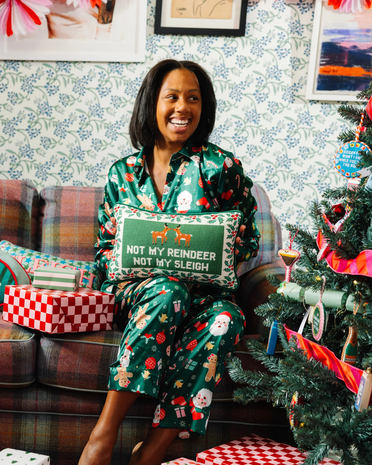 Needlepoint holiday pillow with orange reindeer and “NOT MY SLEIGH” lettering