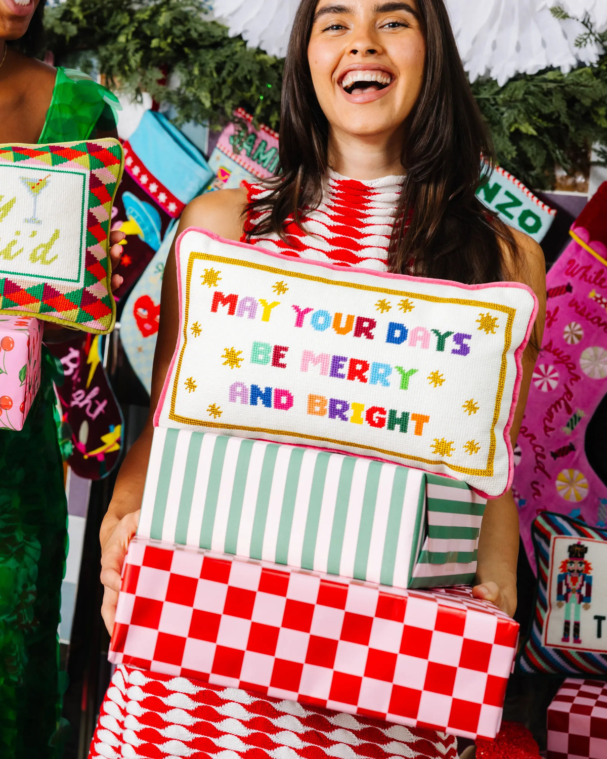 Needlepoint pillow with 'May your days be merry and bright' message, pink edge