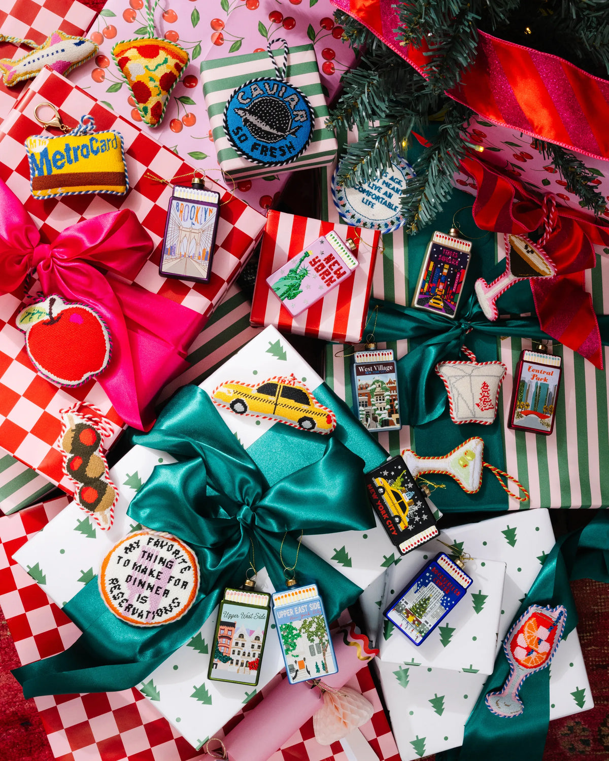 Assorted matchbook ornaments and holiday decorations in red and green gift wrap
