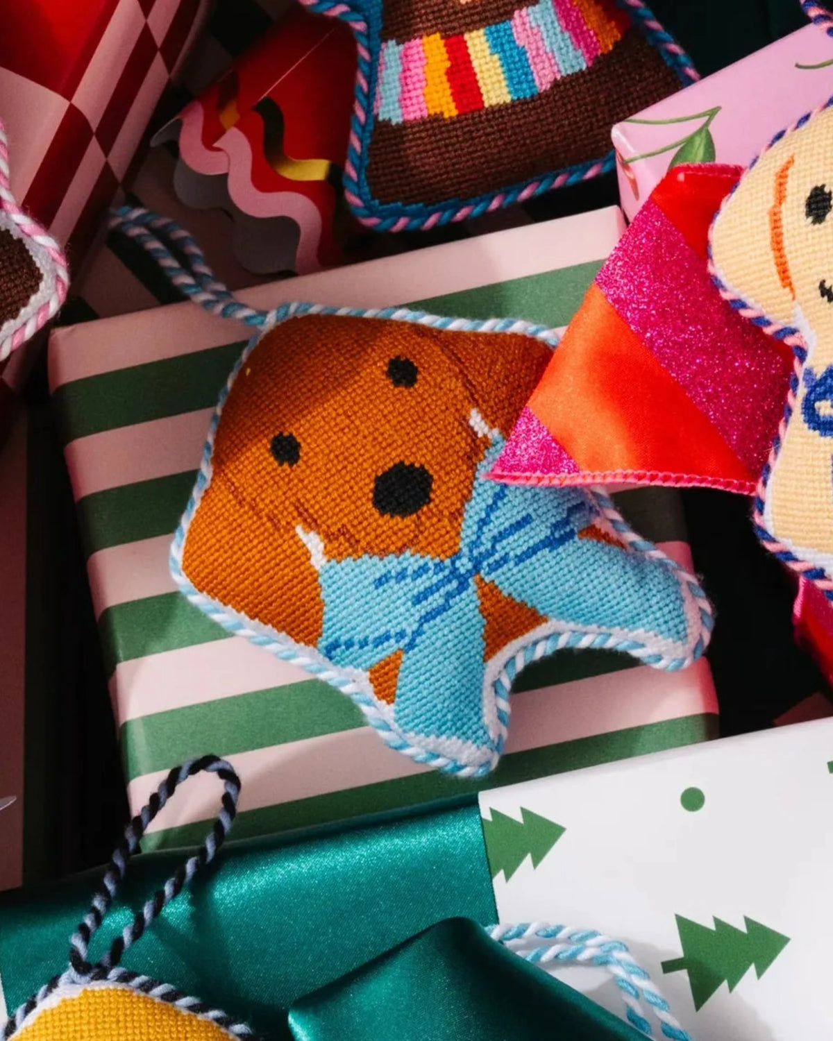 Needlepoint dachshund icon ornament with hanging loop, orange dog face on blue-edged star