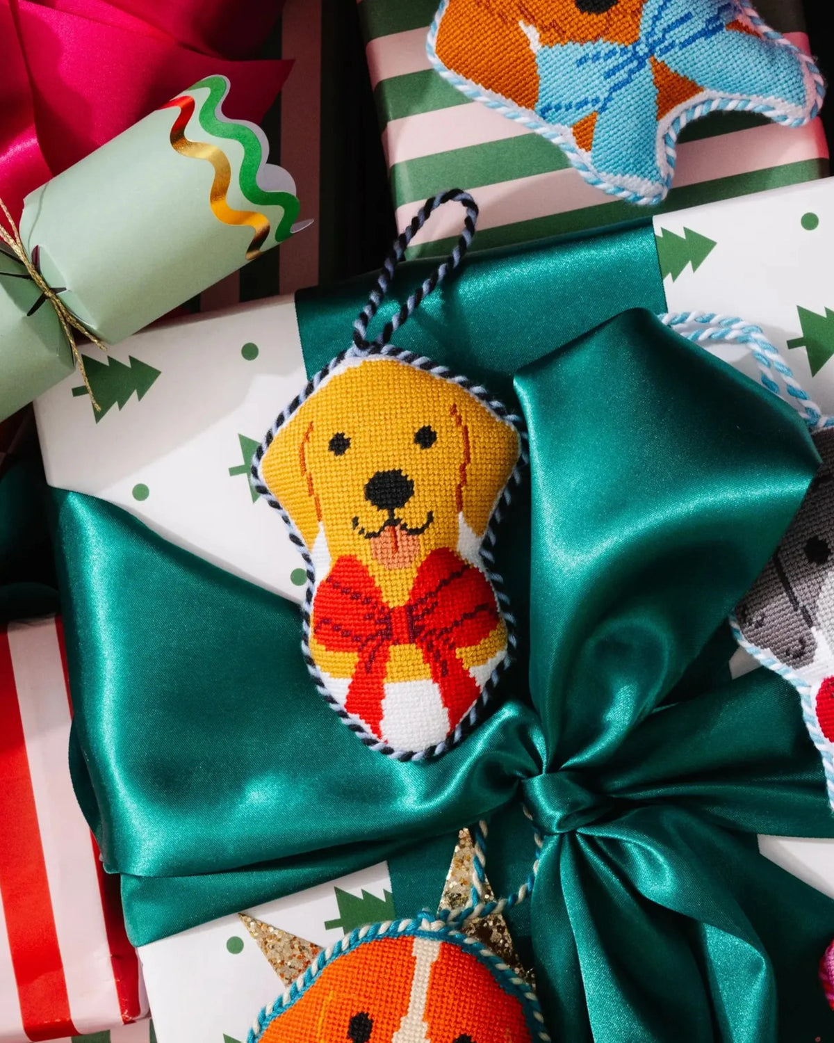 Needlepoint golden retriever ornament with red scarf and hanging loop