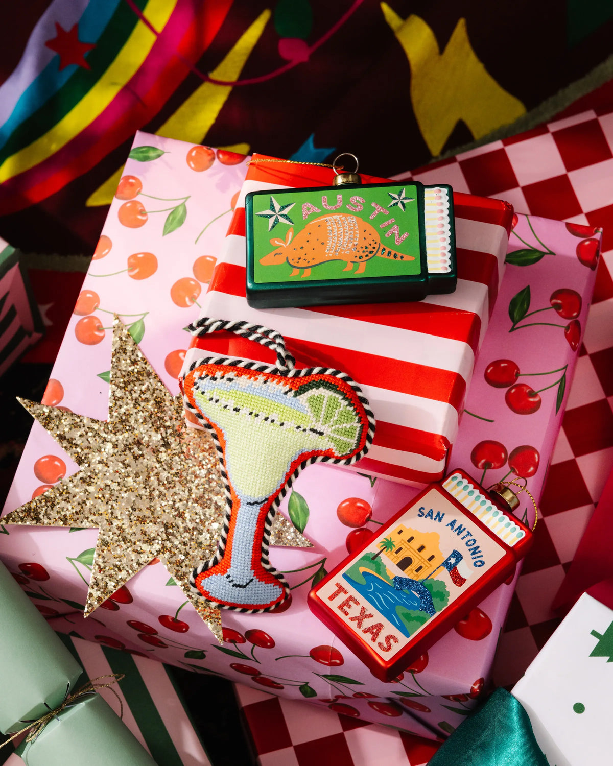 Austin matchbook ornament with decorative border on wrapped gift boxes