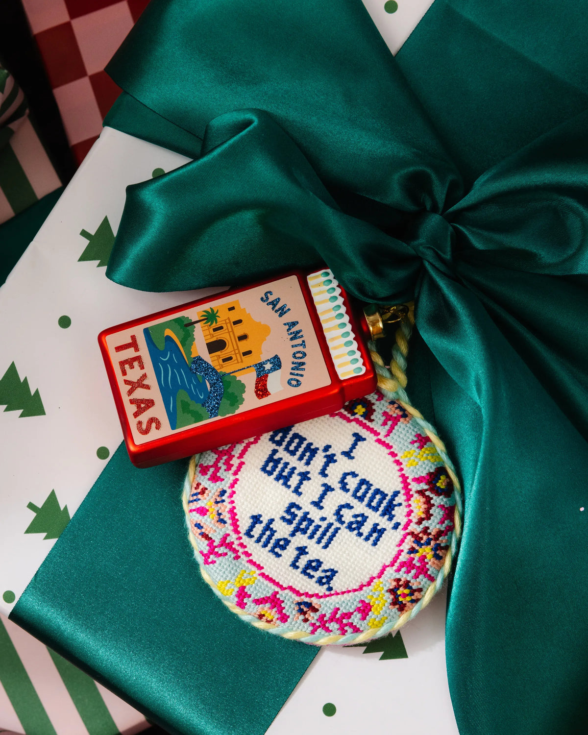 Red matchbook ornament with 'SAN ANTONIO' and 'TEXAS' lettering, hanging