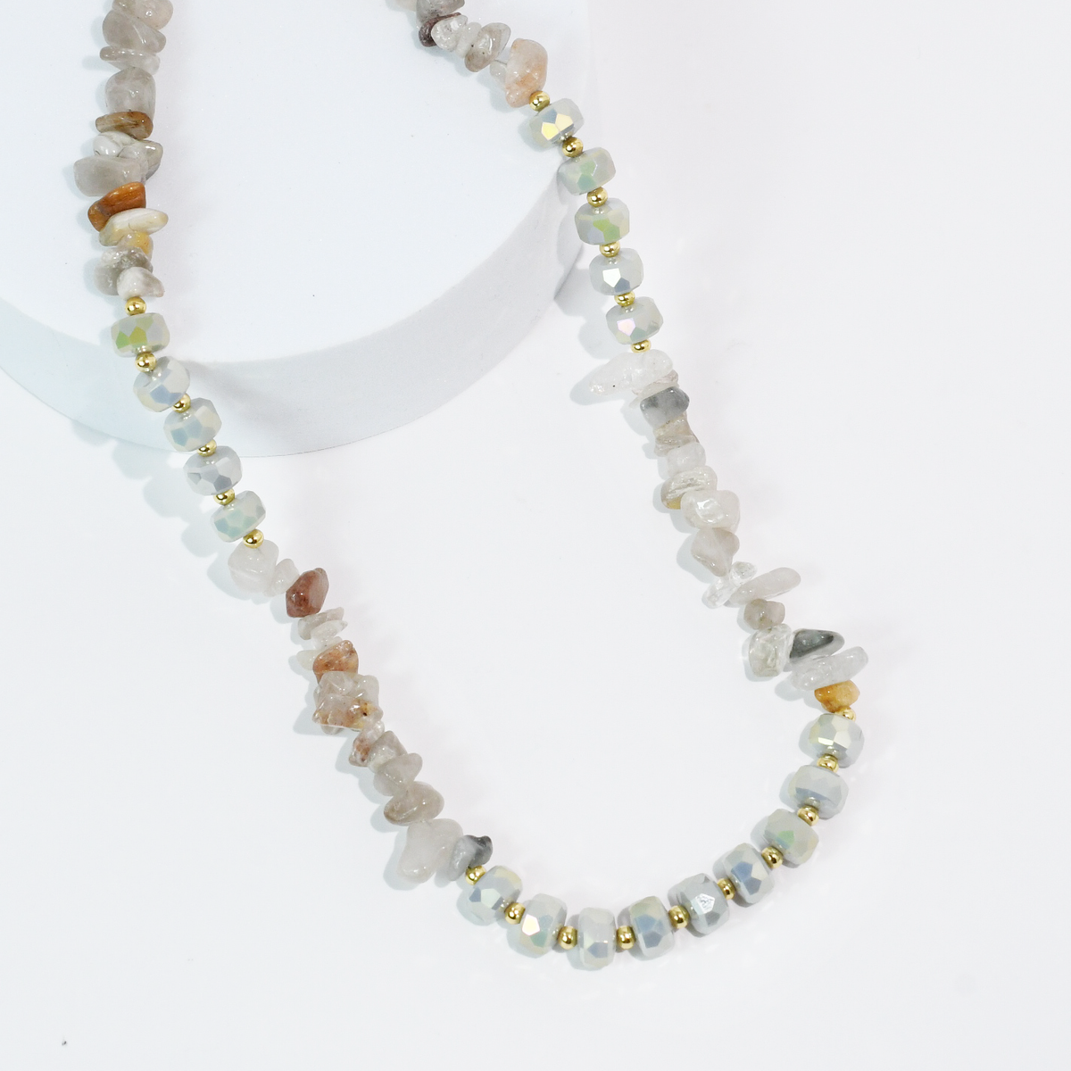 Mixed neutral beaded quartz necklace with light stones and gold-tone spacer beads.