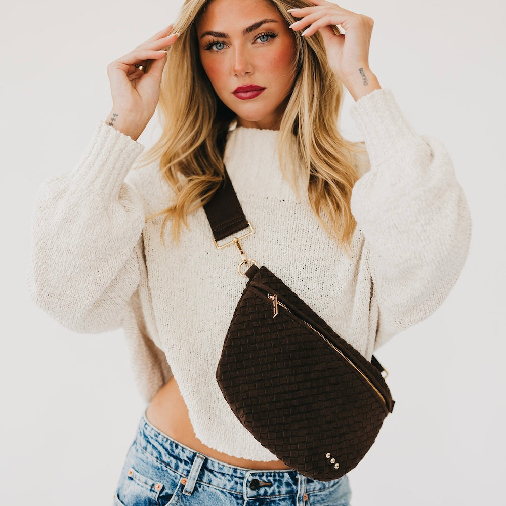 Suede Westlyn woven bum bag in black, zip top and adjustable crossbody strap.