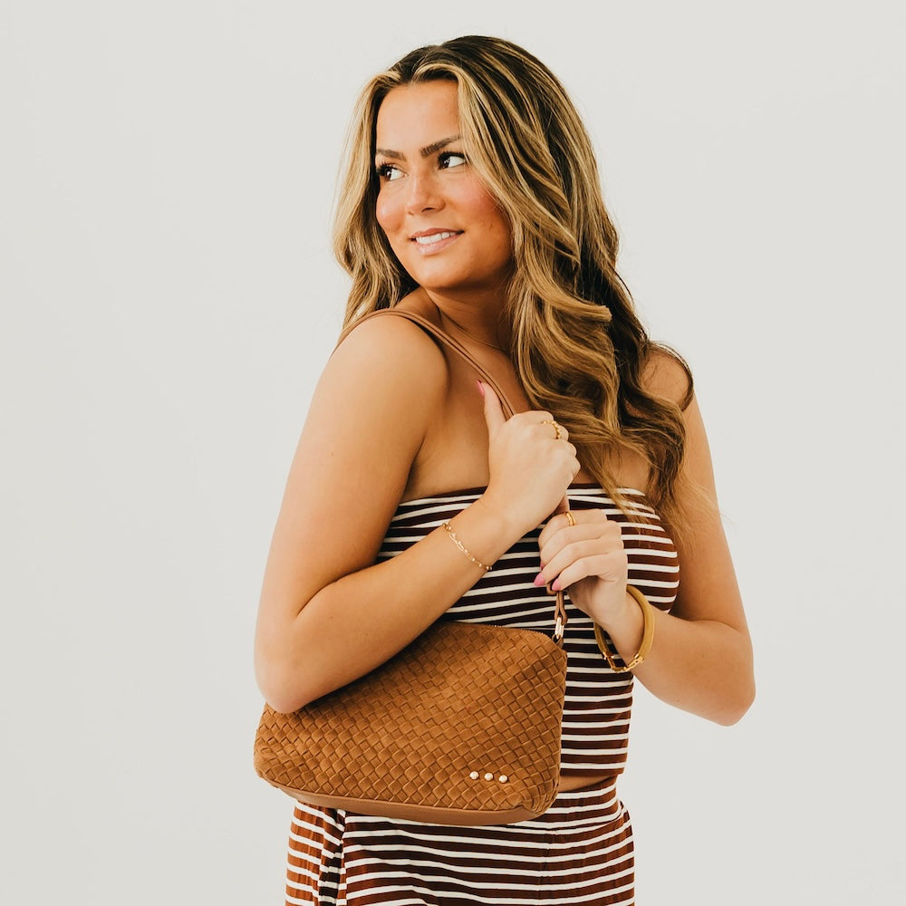 Tan woven suede hobo shoulder bag with braided strap and gold snap details
