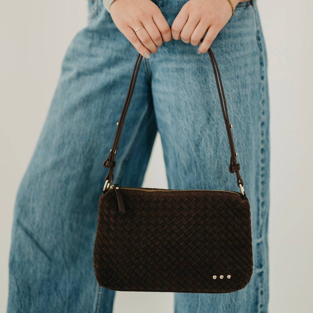Dark brown woven suede hobo shoulder bag with braided strap and gold snap details