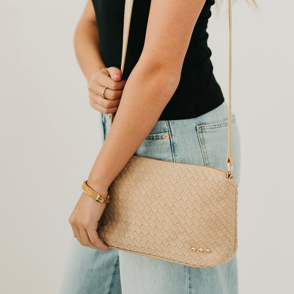 Light tan woven suede hobo shoulder bag with braided strap and gold snap detailing