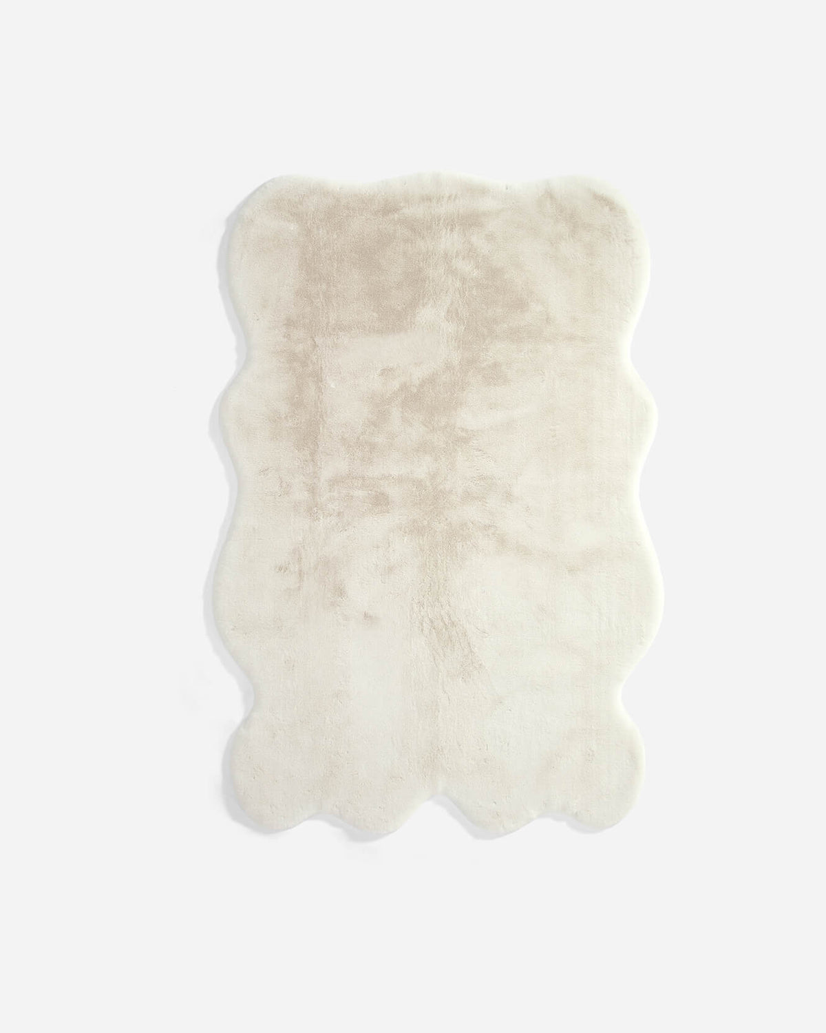 White faux fur large rug with wavy border and plush shag pile