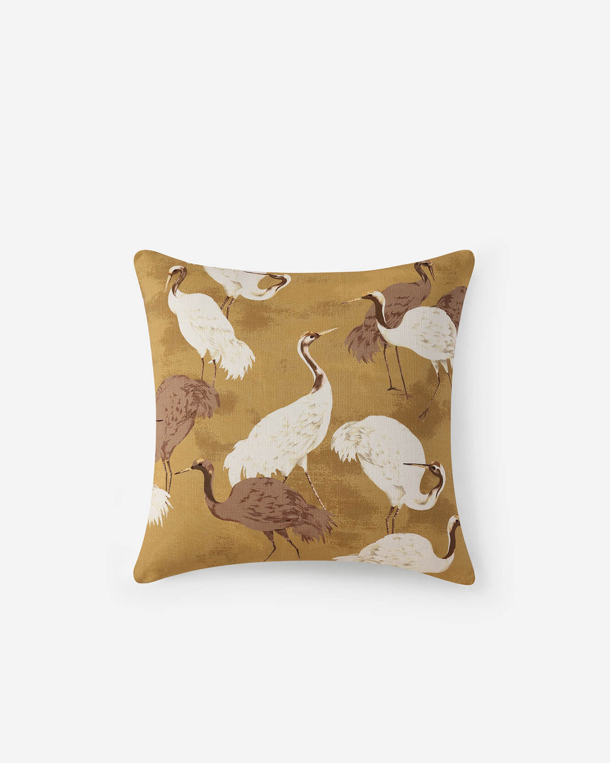 Gold throw pillow with white and brown crane print design