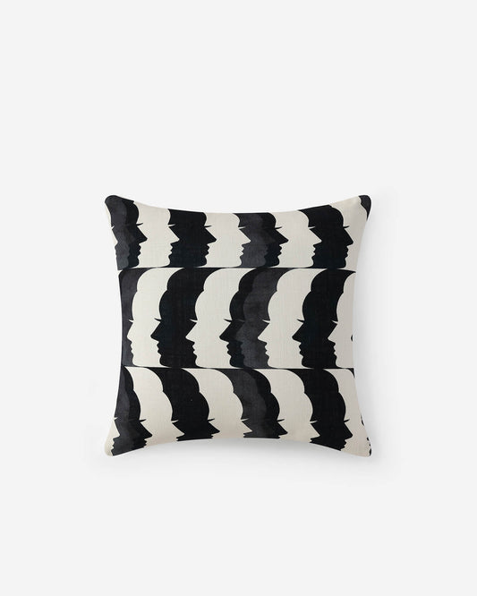 Off-white throw pillow with black zigzag crescent pattern, square back