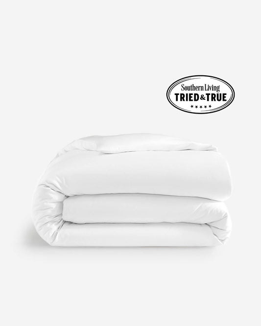 White duvet cover, folded with smooth fabric and stitched edges