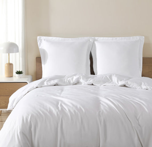 White duvet cover on bed with smooth front and matching pillow shams