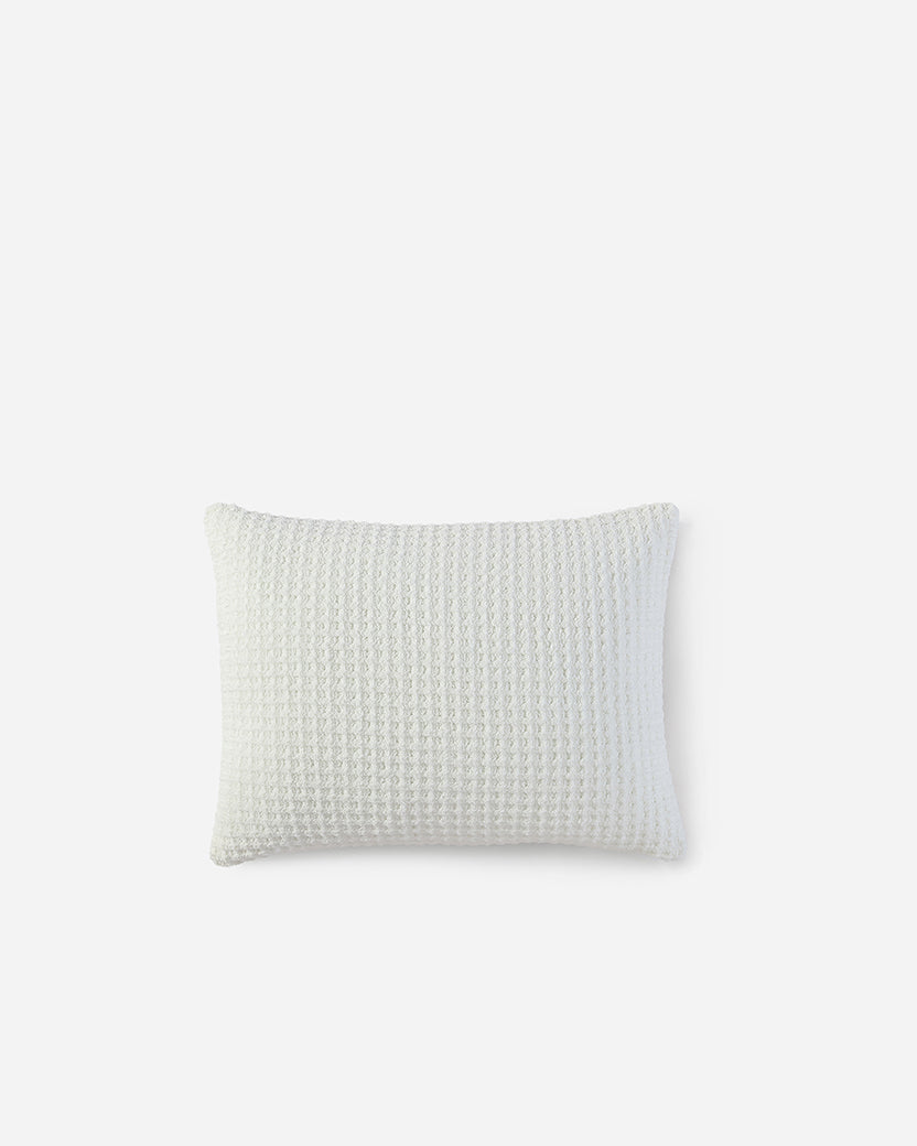Off-white waffle square sham pillow with subtle grid texture