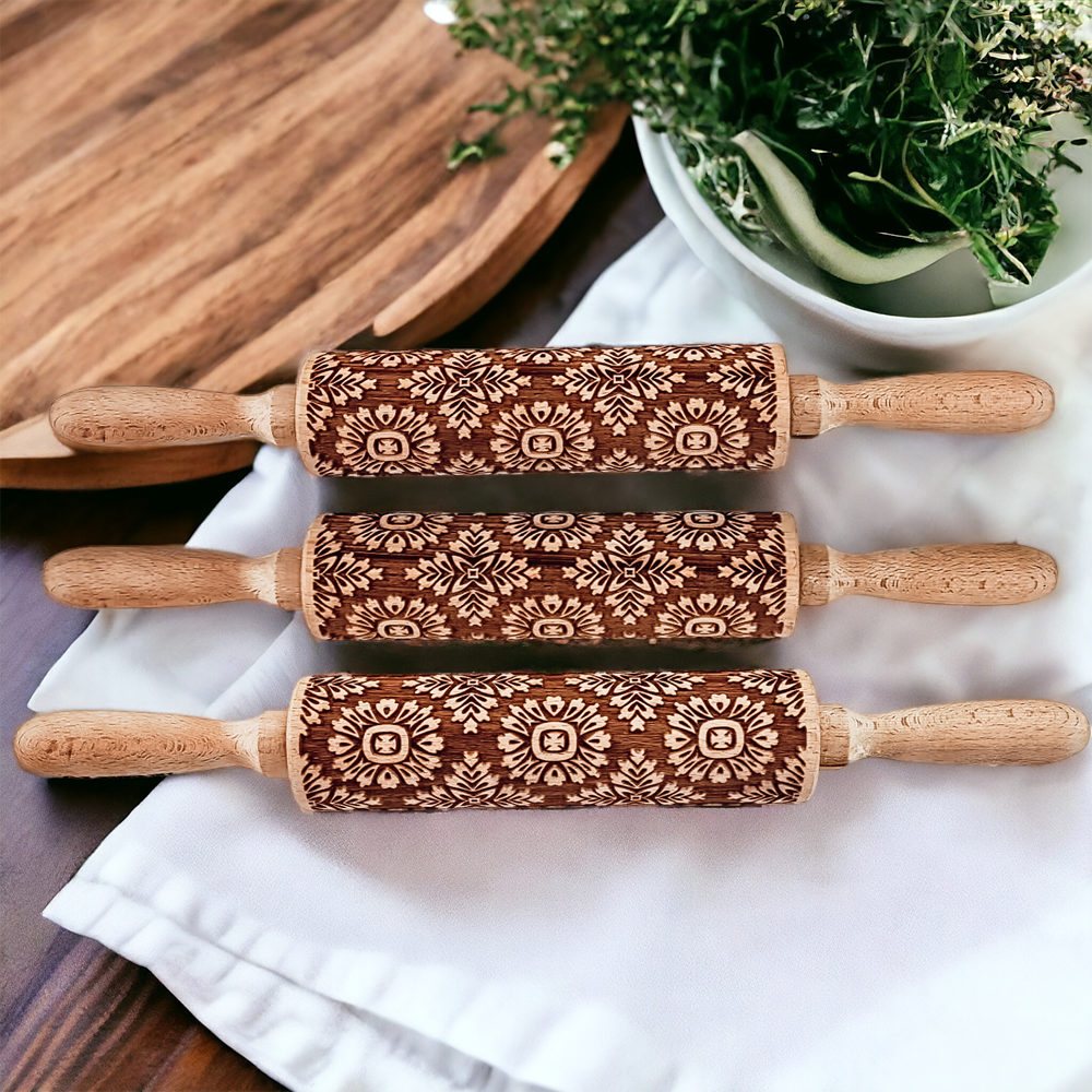 Decorative rolling pin set on white cloth with wood handles and brown geometric sleeves