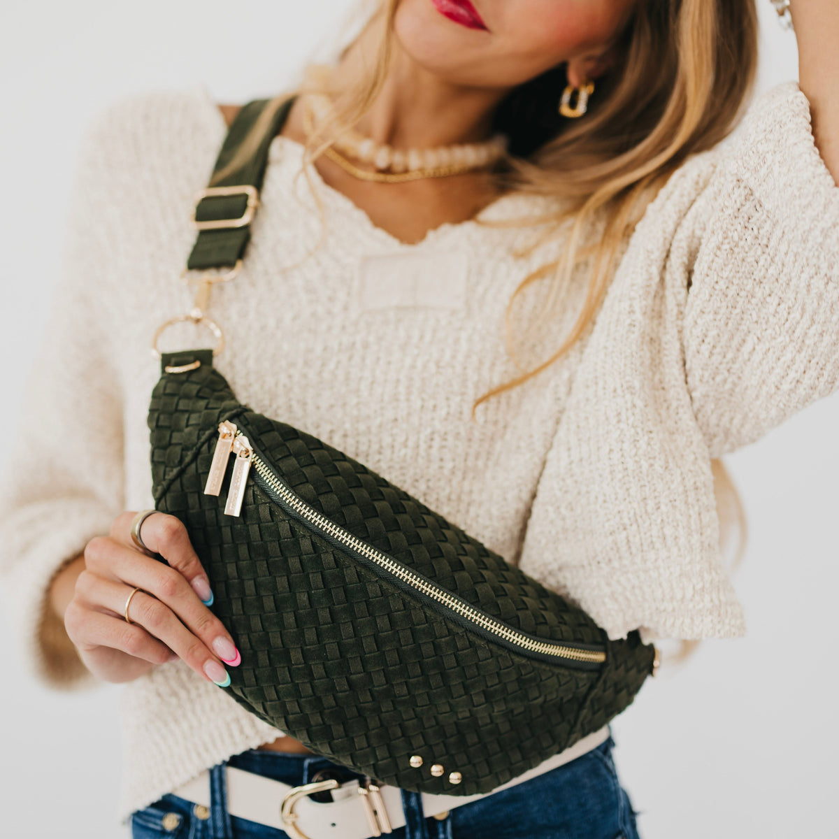 Woven suede bum bag in dark olive with zip front and gold-tone hardware.
