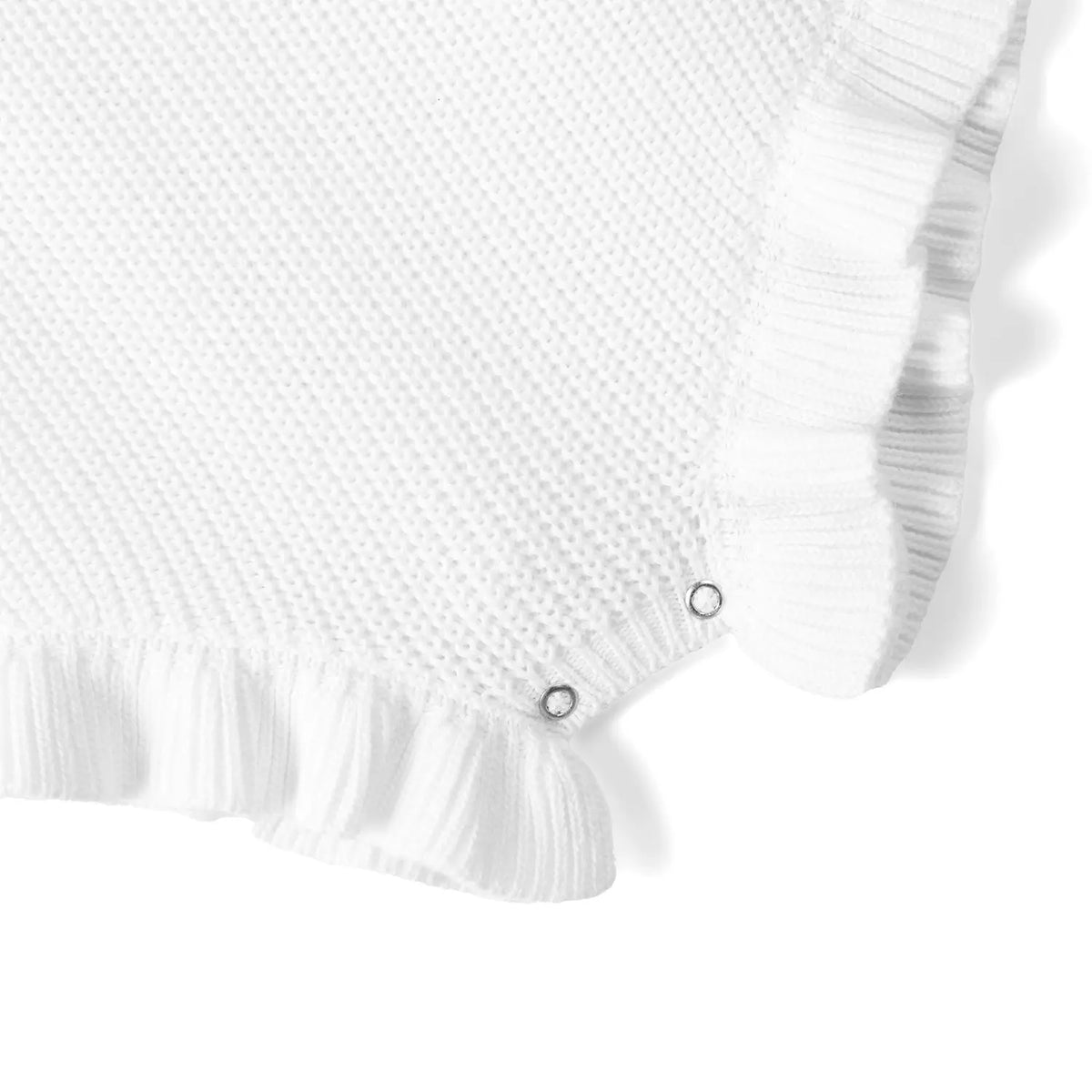 White knitted baby romper with ruffle hem and three snap buttons