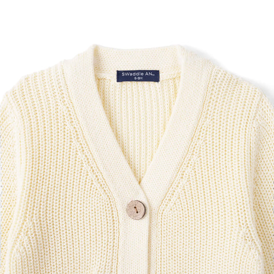 Cream knit cardigan with V-neck and single-breasted button placket