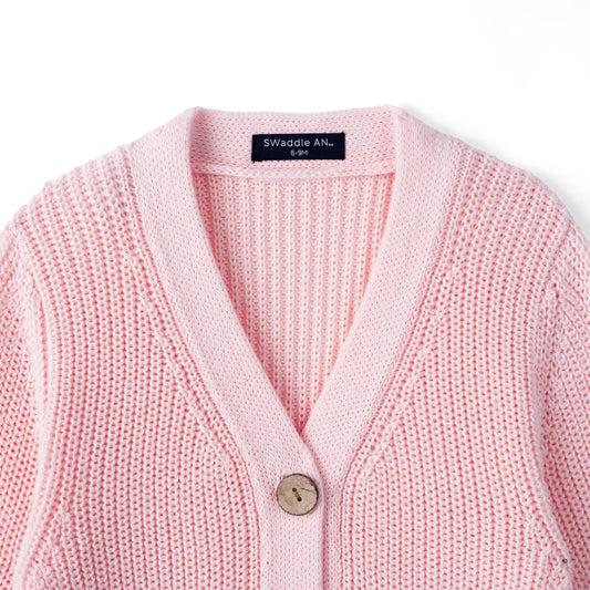Pink knit cardigan with V-neck, single-button closure at center front