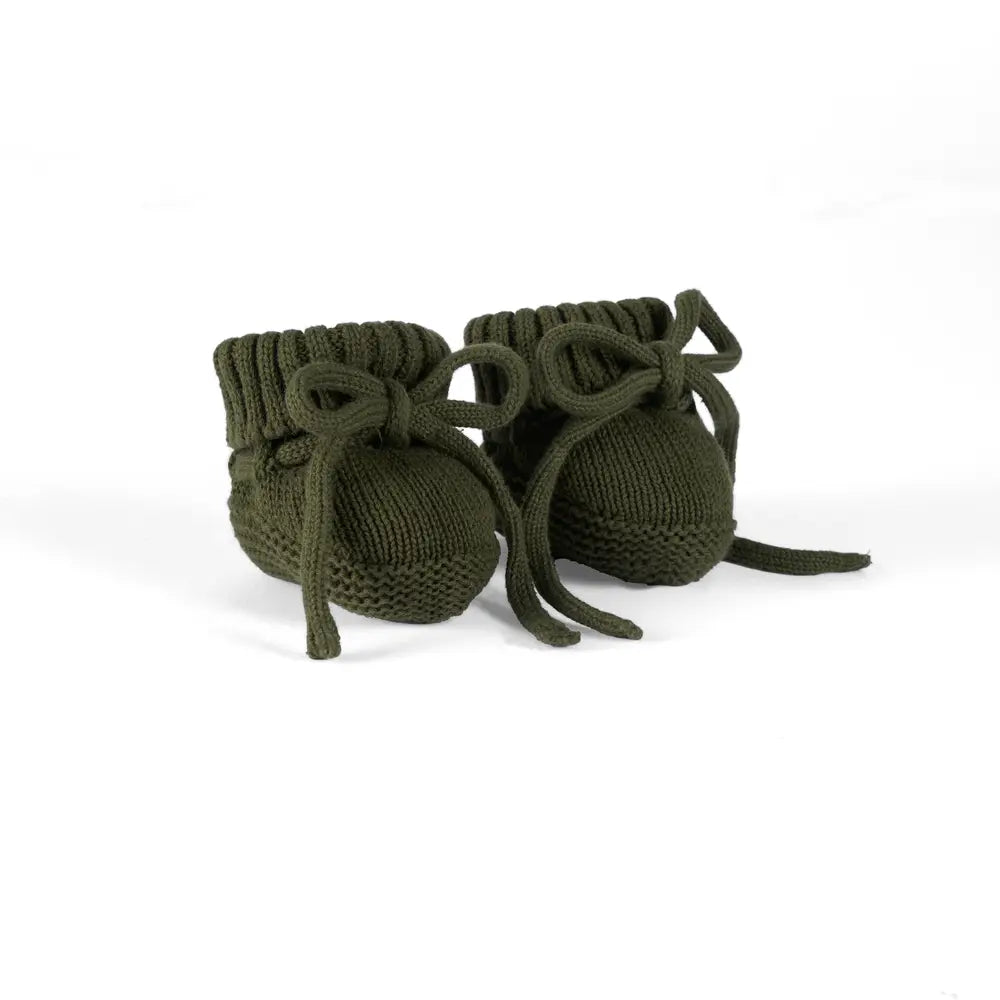Forest green knitted baby booties with ribbed cuffs and lace-tie straps, pair