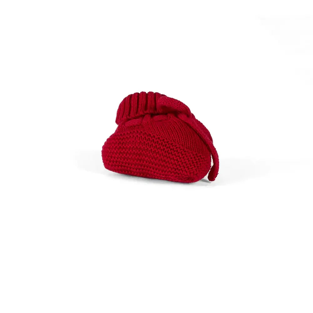 Single red knitted baby bootie with ribbed cuff and tie cord