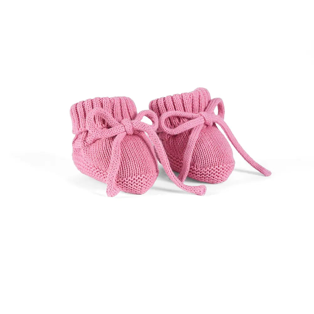 Rose pink knitted baby booties with gathered cuffs and bow ties