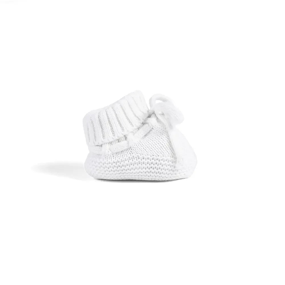 White knitted baby booties with ribbed cuffs and bow laces