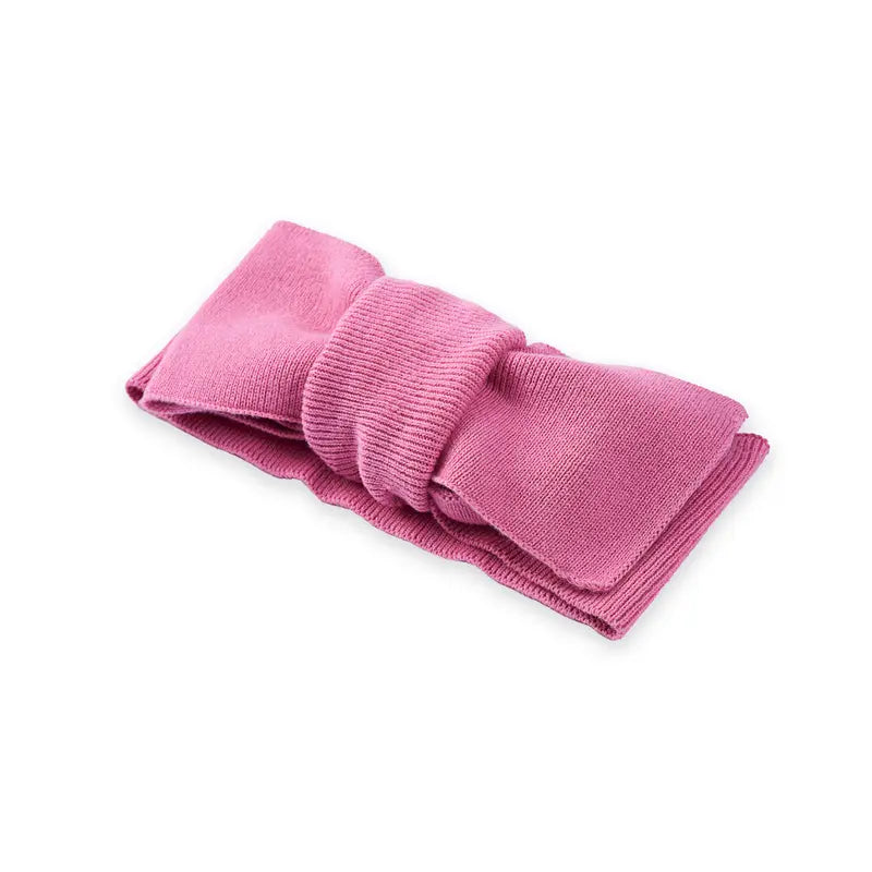 Rose pink knitted oversized topknot headband, angled view with bow layers