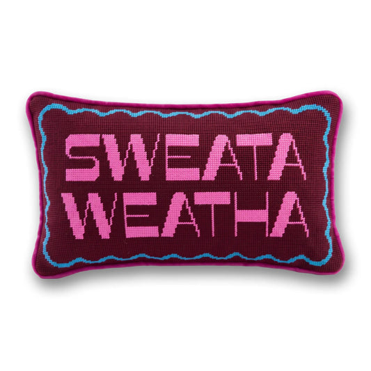 Needlepoint throw pillow with purple and pink 'SWEATA WEATHA' lettering